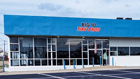 a big 10 tire pros store with a blue roof