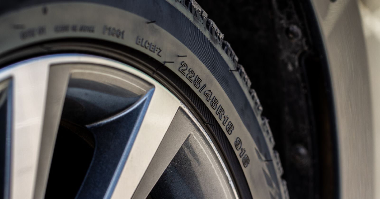 a close up of a tire on a car wheel to accompany a tire sizing guide article
