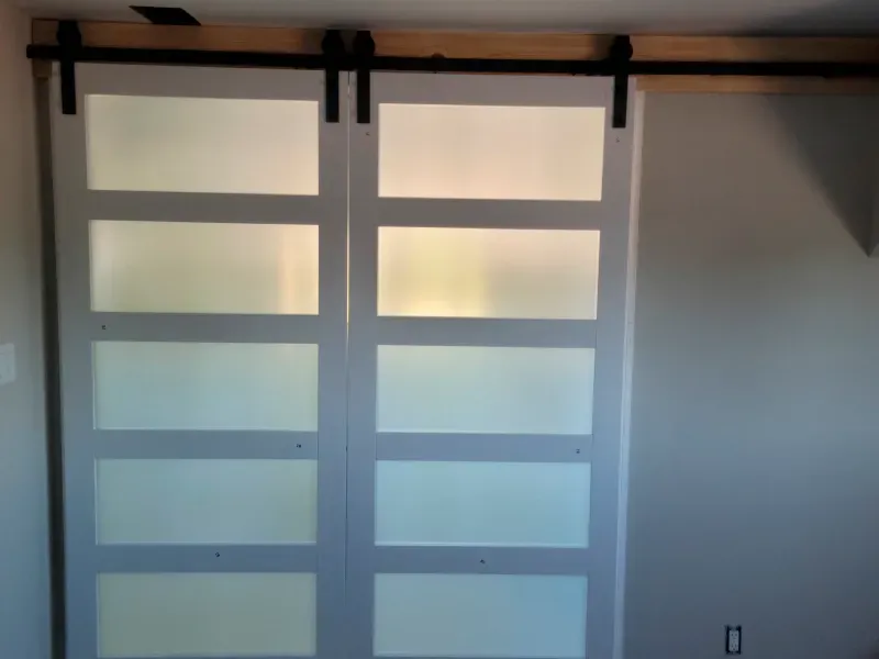 A pair of sliding barn doors in a room