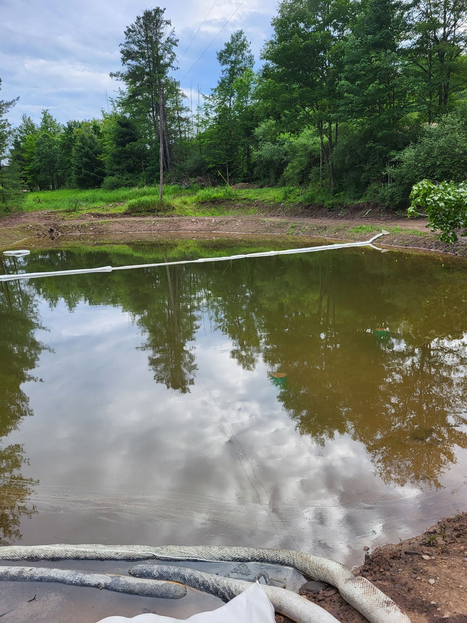Elk deployed boons to protect the pond from the diesel spill. 