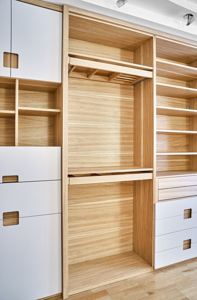 An Empty Walk In Closet With Wooden Shelves And Drawers — North Coast Cabinets In South Lismore, NSW