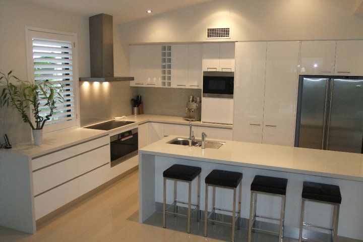 A Kitchen With A Table And Chairs In It — North Coast Cabinets In Murwillumbah, NSW