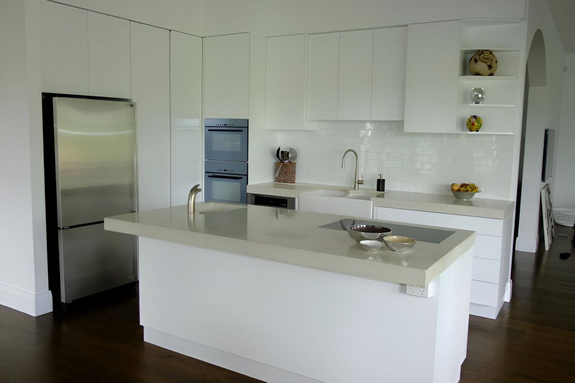 A Kitchen With White Cabinets And Stainless Steel Appliances — North Coast Cabinets In Murwillumbah, NSW