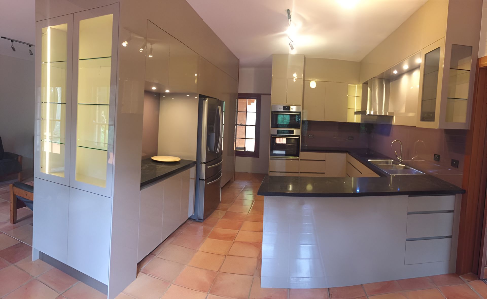 A Kitchen With White Cabinets And A Black Counter Top — North Coast Cabinets In Lismore, NSW