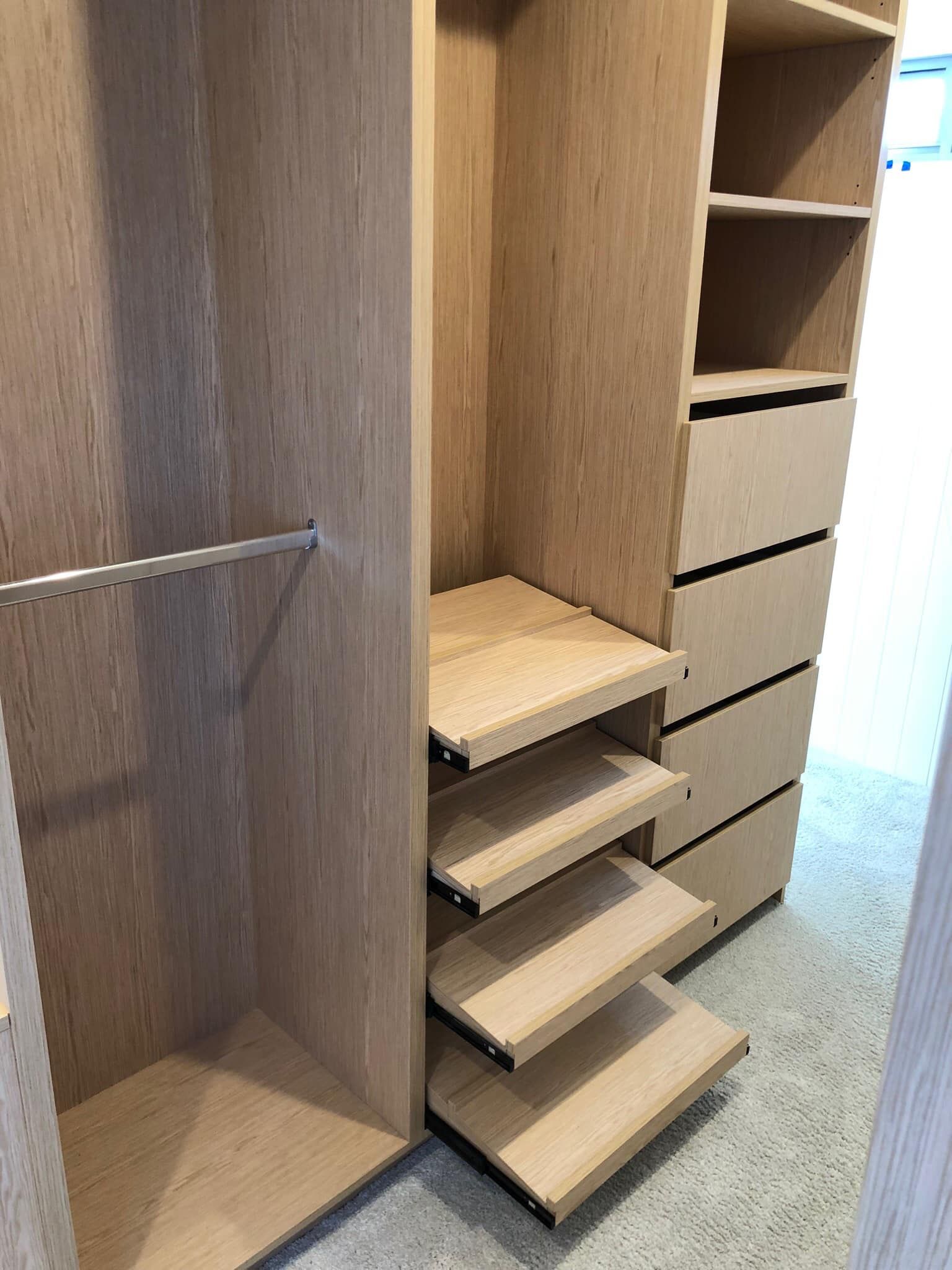 A Walk In Closet With Wooden Shelves And Drawers — North Coast Cabinets In South Lismore, NSW