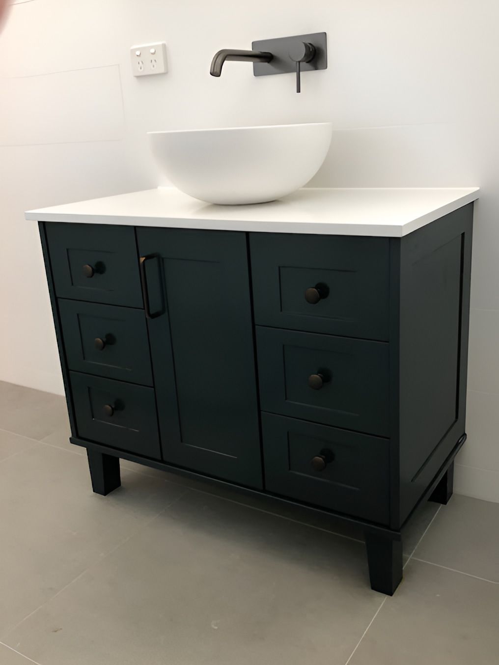 A Bathroom Vanity With A Sink On Top Of It — North Coast Cabinets In South Lismore, NSW