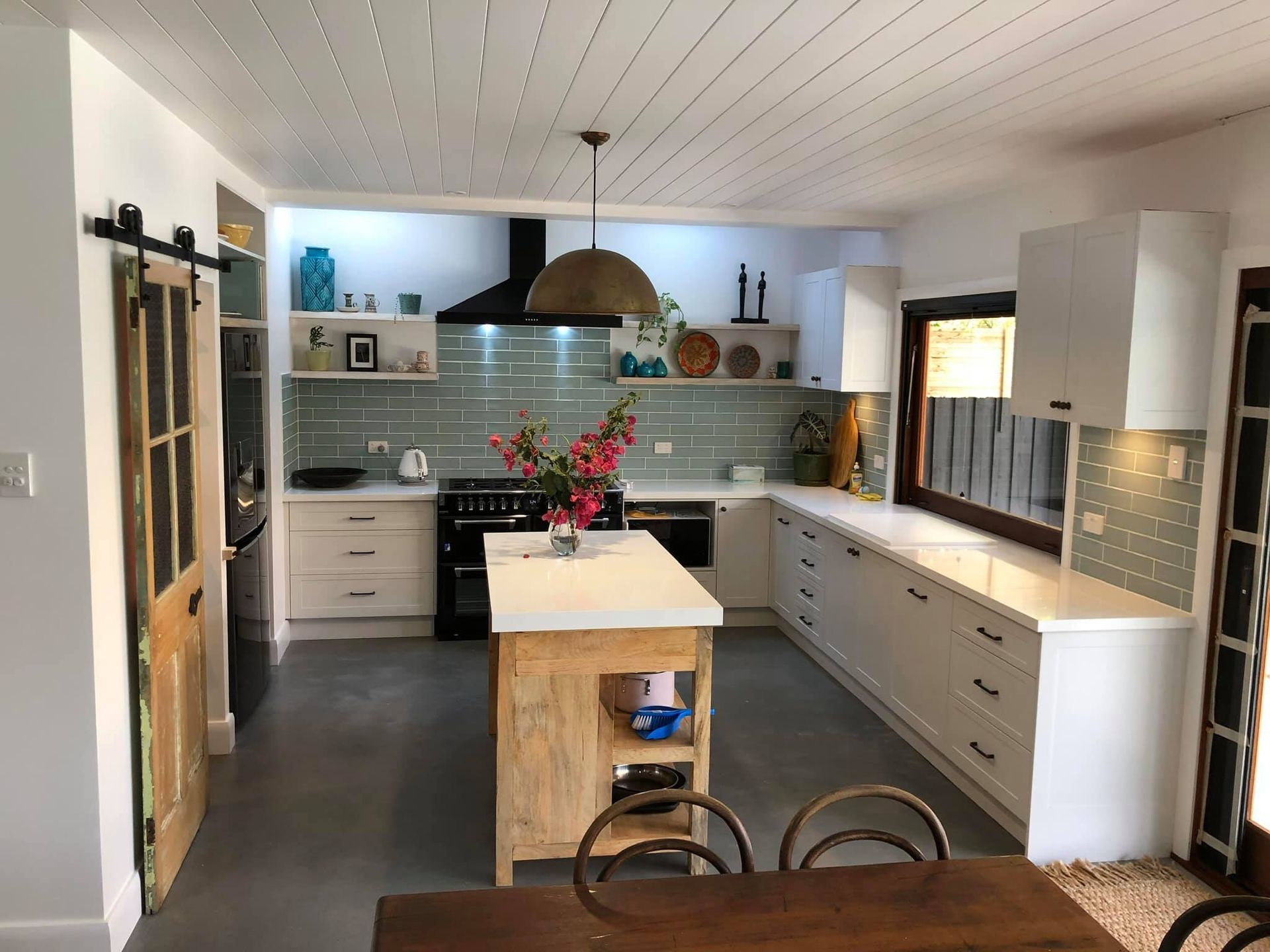 A Kitchen With White Cabinets And A Wooden Island — North Coast Cabinets In South Lismore, NSW