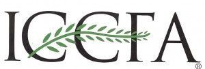 a logo for iccsa with a green branch in the middle .