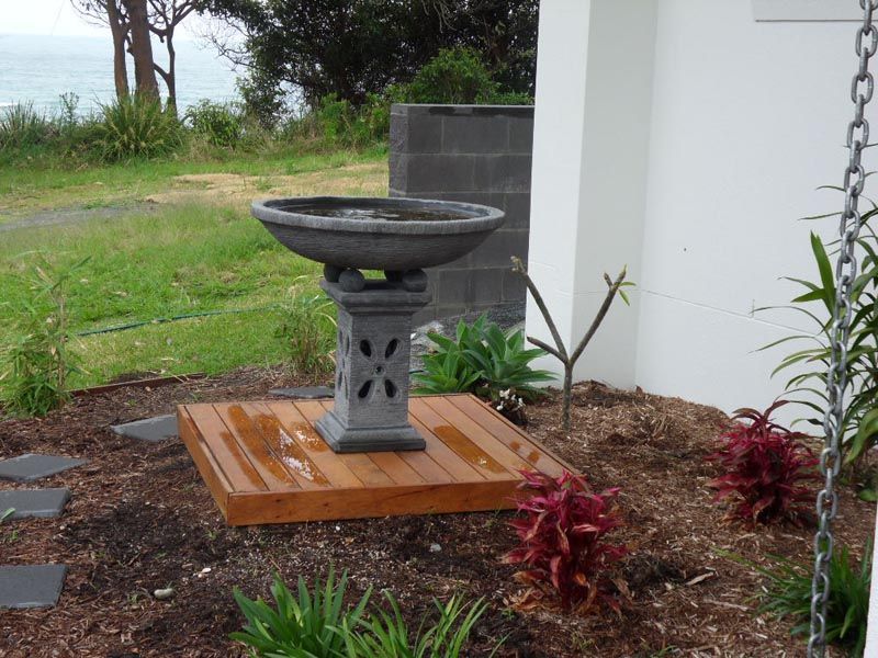 A Bird Bath on a Wooden Platform — Coffs Harbour, NSW — Coolamon Concrete Tanks
