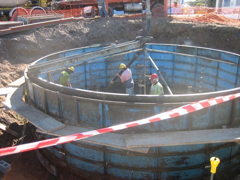 Workers Working on a Large Blue Tank — Coffs Harbour, NSW — Coolamon Concrete Tanks
