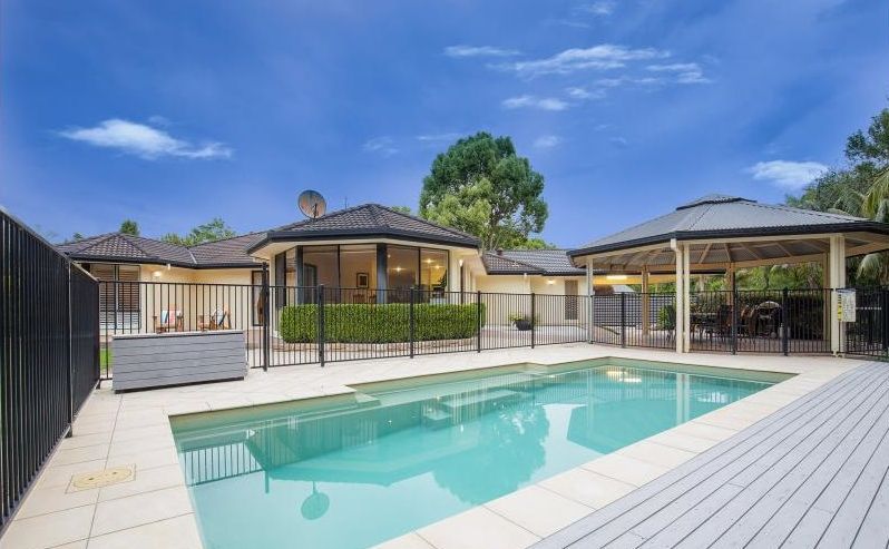 A Pool with a Fence Around It — Coffs Harbour, NSW — Coolamon Concrete Tanks