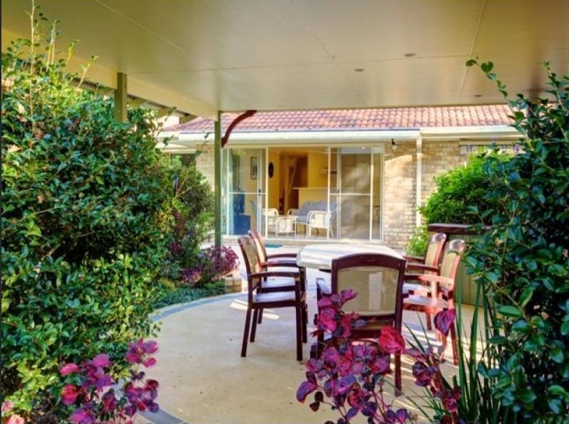 A Patio with Chairs and a Table — Coffs Harbour, NSW — Coolamon Concrete Tanks