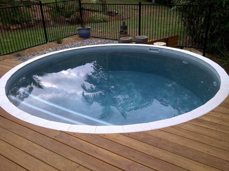 Pool with a Wooden Deck — Coffs Harbour, NSW — Coolamon Concrete Tanks