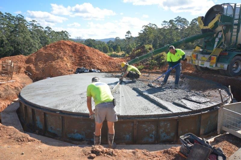 Few Men Working on a Concrete Slab — Coffs Harbour, NSW — Coolamon Concrete Tanks