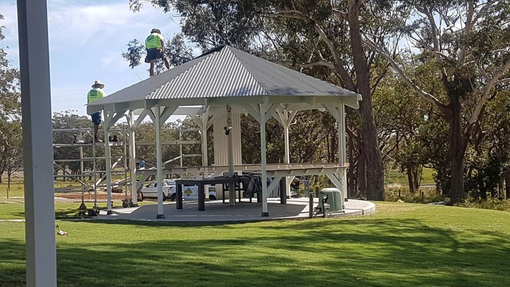 A Person Standing on Top of a Gazebo — Coffs Harbour, NSW — Coolamon Concrete Tanks