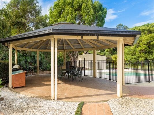 A Gazebo with a Pool in the Background — Coffs Harbour, NSW — Coolamon Concrete Tanks