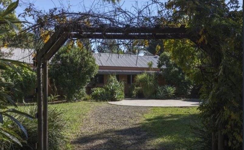 A House with a Wooden Arch — Coffs Harbour, NSW — Coolamon Concrete Tanks