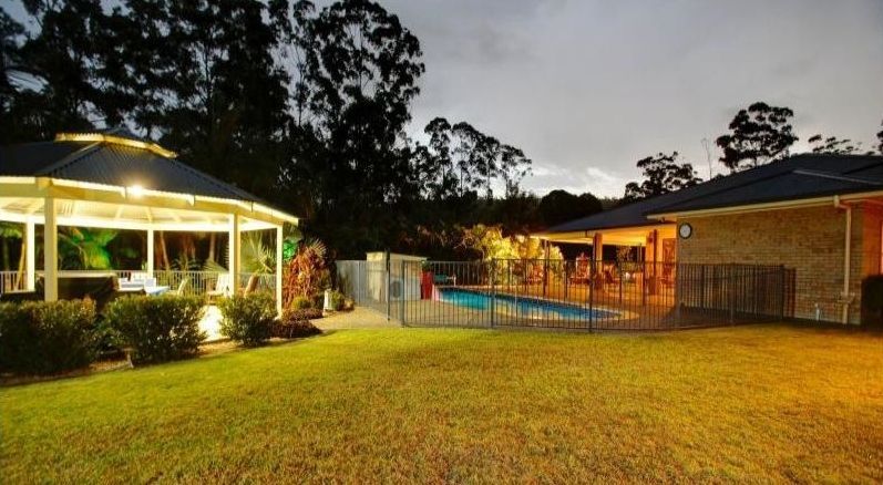 House with a Pool in the Back Yard — Coffs Harbour, NSW — Coolamon Concrete Tanks