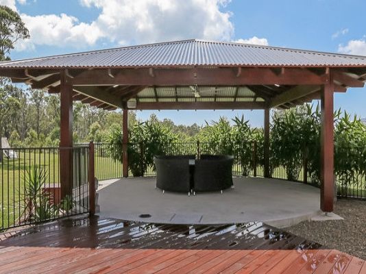 Gazebo with Wooden Deck and Metal Fence — Coffs Harbour, NSW — Coolamon Concrete Tanks