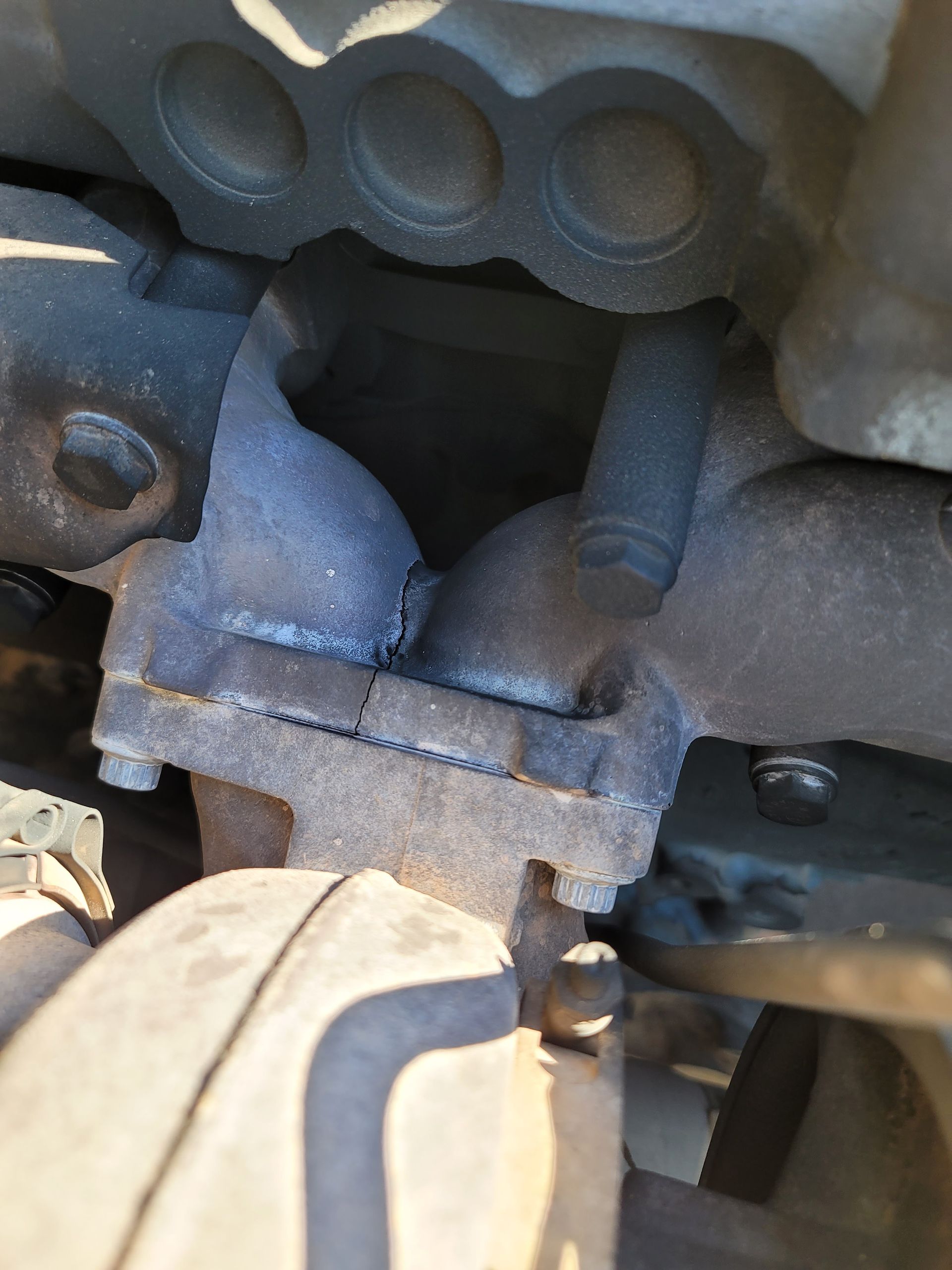 A close up of a exhaust pipe on a car.