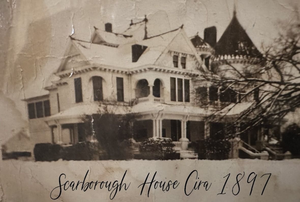 Scarborough House, circa 1897. Victorian house covered in snow. Front porch and turret visible.