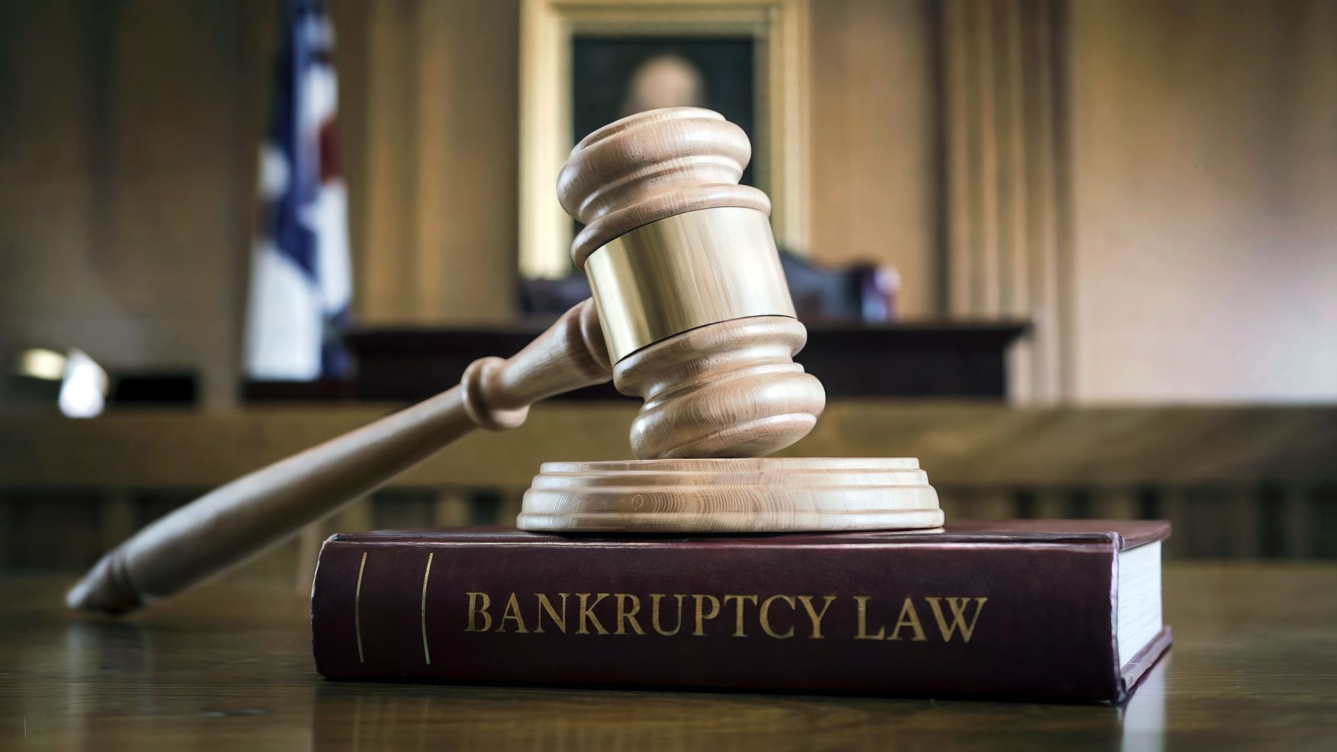 Gavel on a book titled Bankruptcy Law; contact a chapter 7 bankruptcy attorney for help.