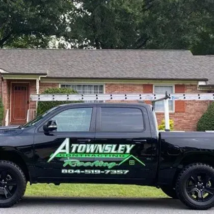A Black Truck is parked in Front of a Brick House - Chester, VA - A. Townsley Contracting