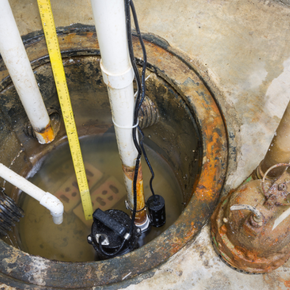 A manhole cover with a pump and a measuring tape in it
