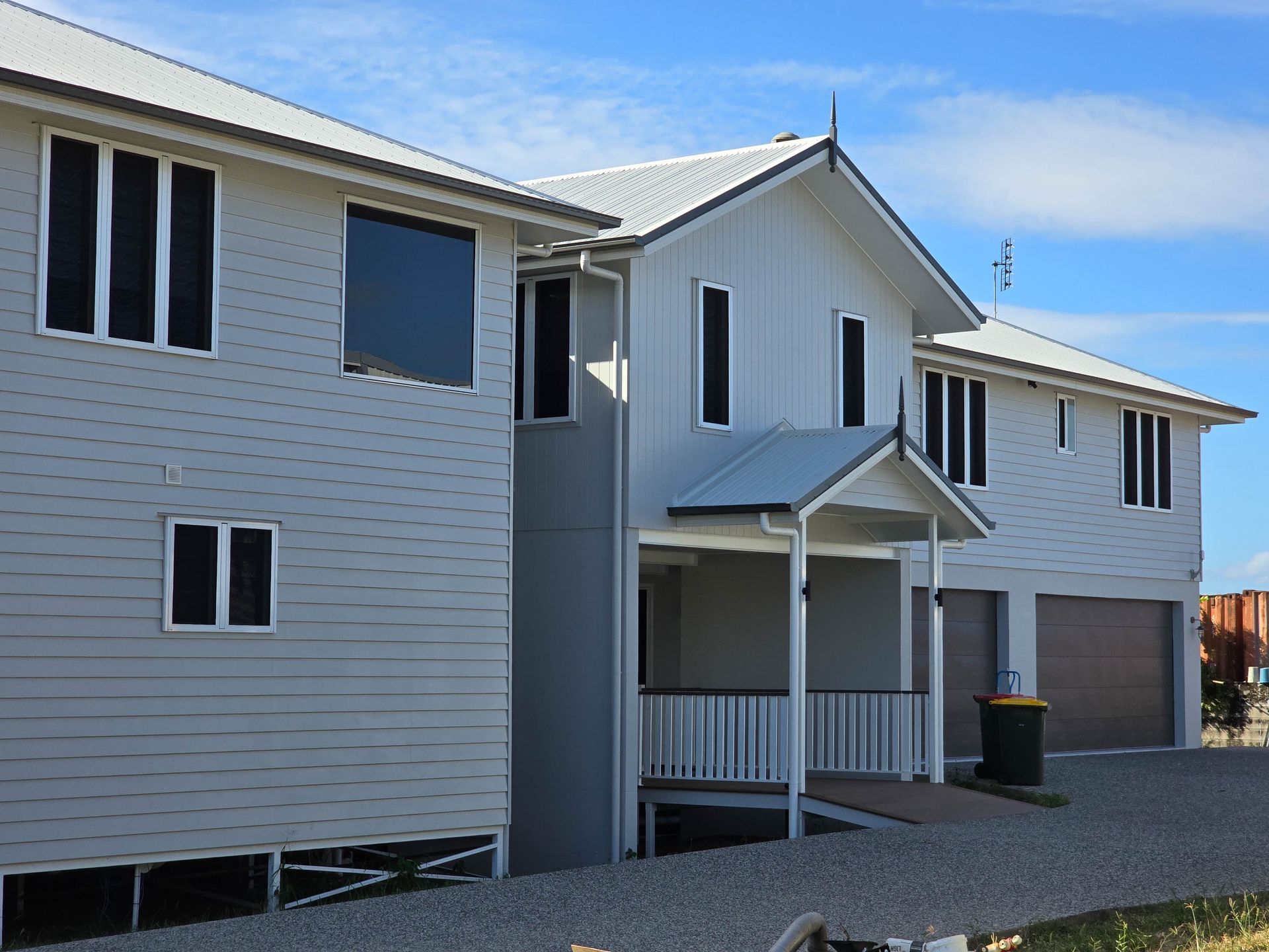 A Couple of Houses Sitting on Top of a Grassy Hill — Drawing Works In Mackay, QLD