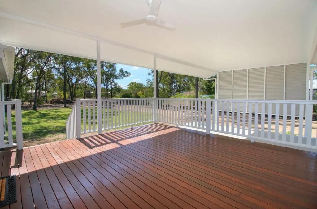 An Empty Deck With a White Railing and a Ceiling Fan — Drawing Works In Townsville City, QLD