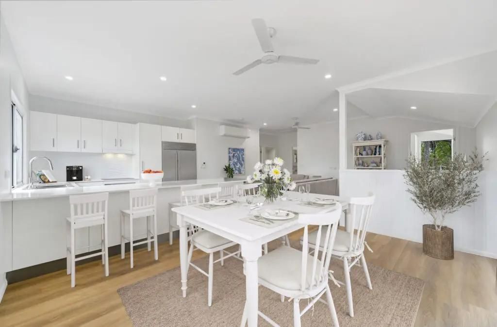 A Dining Room With a Table and Chairs and a Ceiling Fan — Drawing Works In Townsville City, QLD