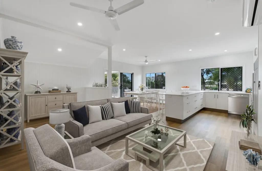 A Living Room With a Couch, Chair, Coffee Table and Ceiling Fan — Drawing Works In Townsville City, QLD