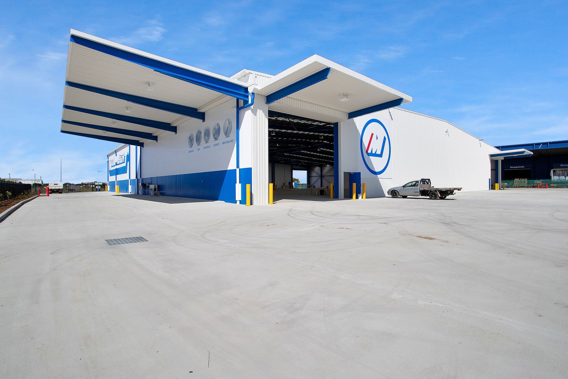 A Large White Industrial Shed With Blue Finishes— Drawing Works In Townsville City, QLD