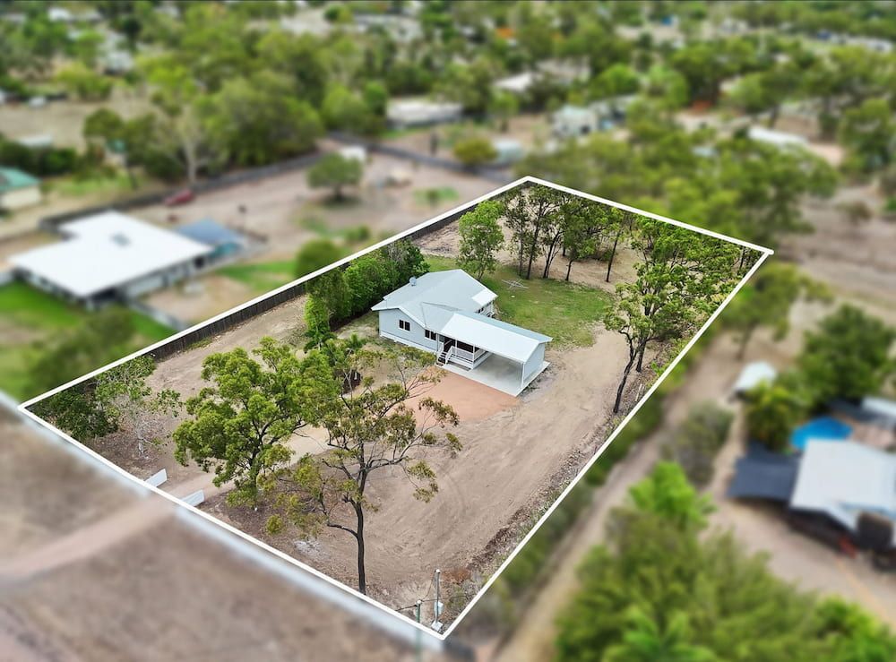 An Aerial View of a House in a Residential Area Surrounded by Trees — Drawing Works In Townsville City, QLD
