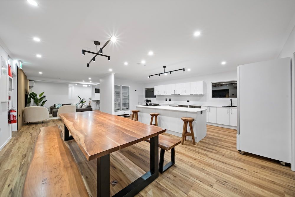 A Large White House With a Driveway Leading to It — Drawing Works In Townsville City, QLD