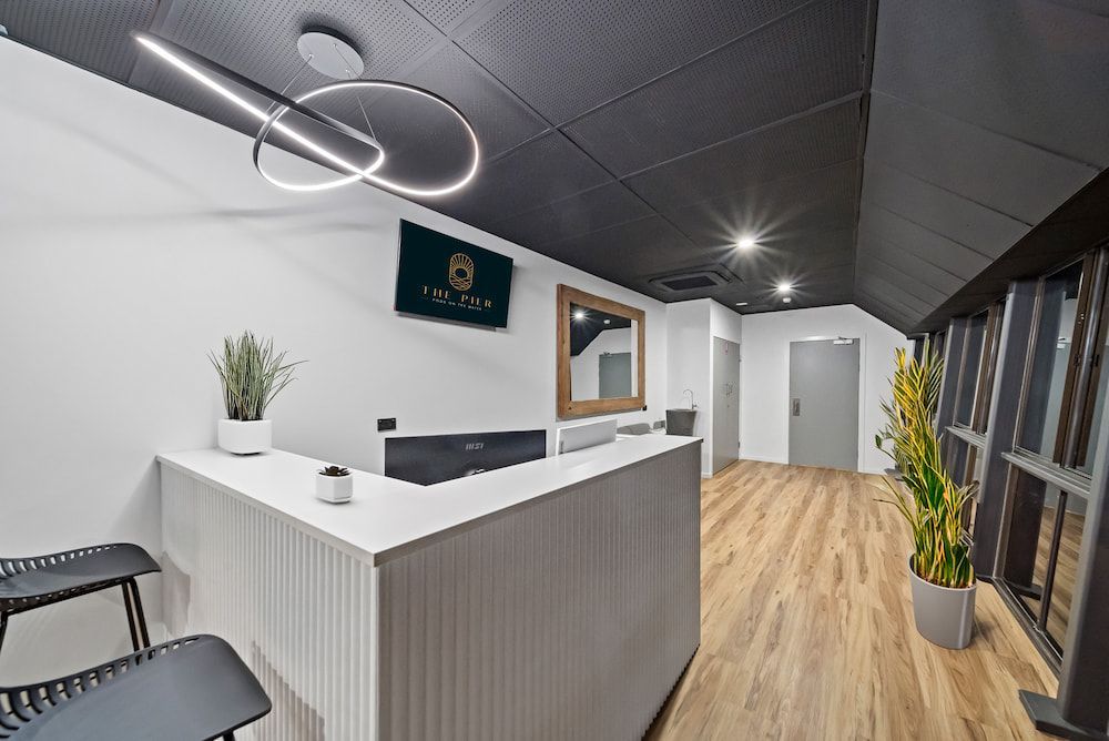 There is a Reception Desk in the Middle of the Room — Drawing Works In Townsville City, QLD