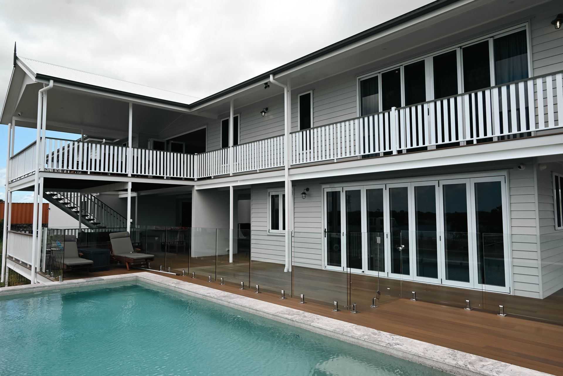 A large white house with a swimming pool in front of it — Drawing Works In Townsville City, QLD