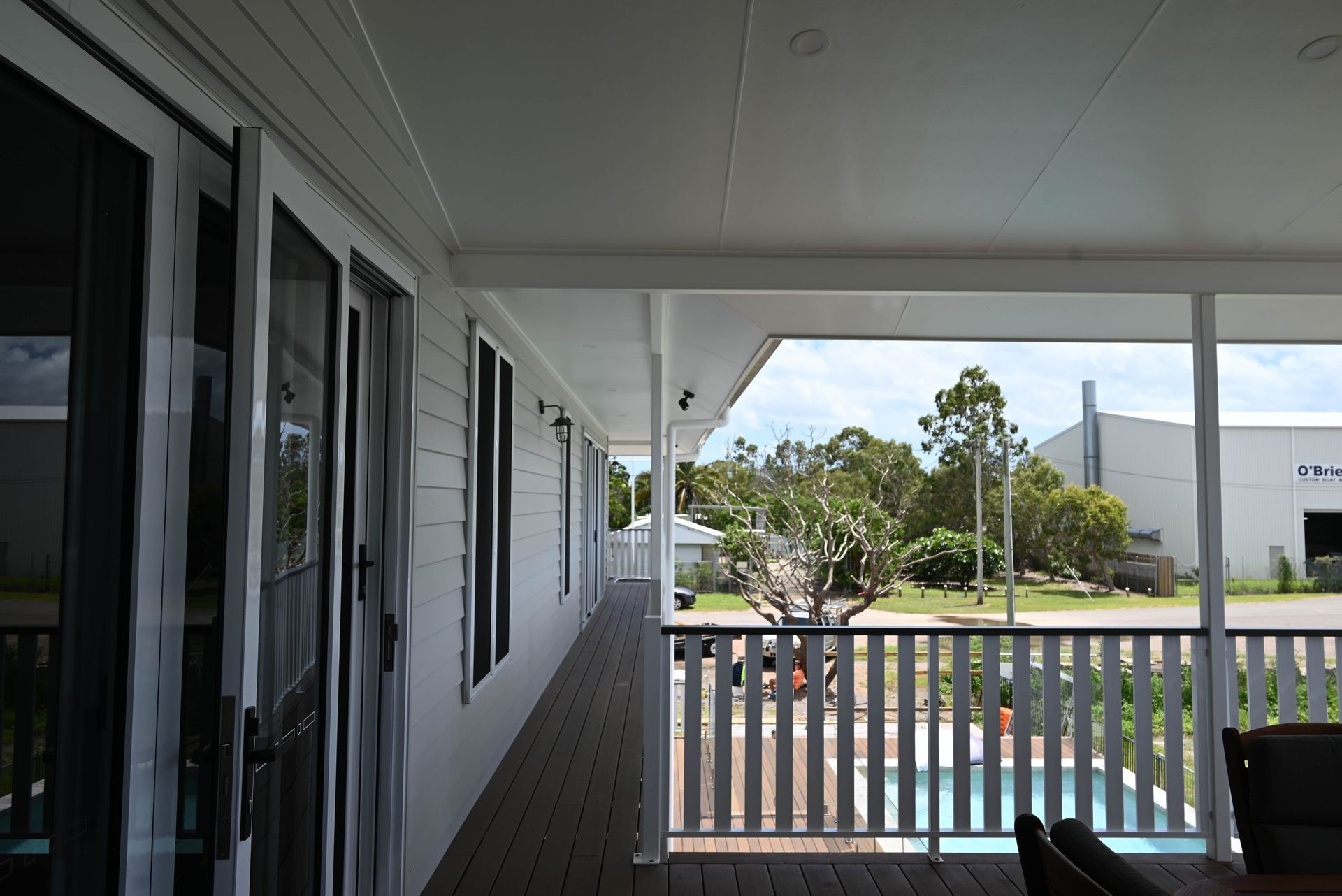 A white house with a porch and a pool — Drawing Works In Hughenden, QLD