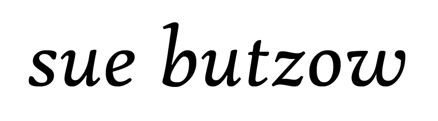 The name sue butzow is written in black on a white background.