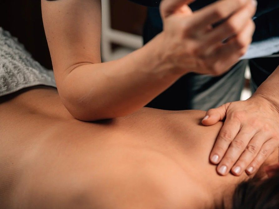 Massage Therapy Coventry performing a lower back deep tissue massage in Coventry
