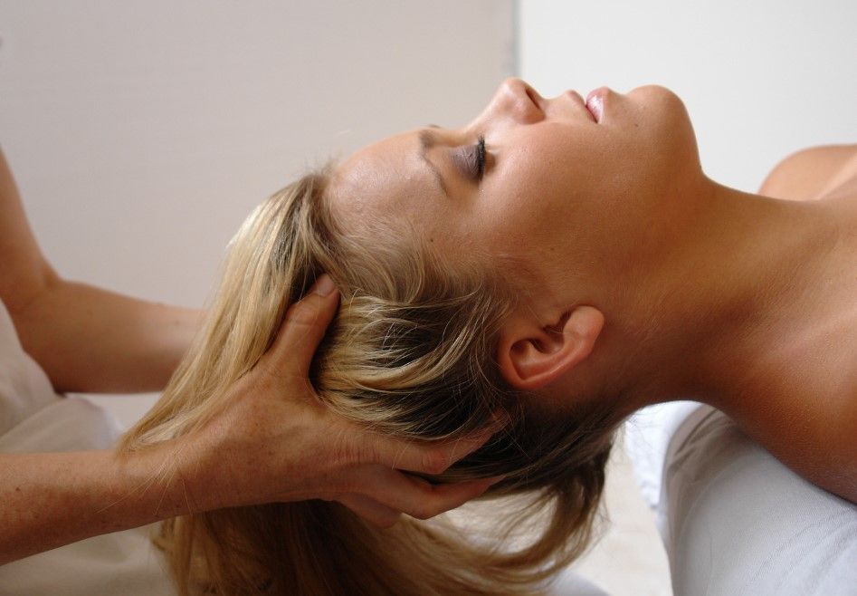 Massage Therapy Coventry performing a scalp massage in Coventry