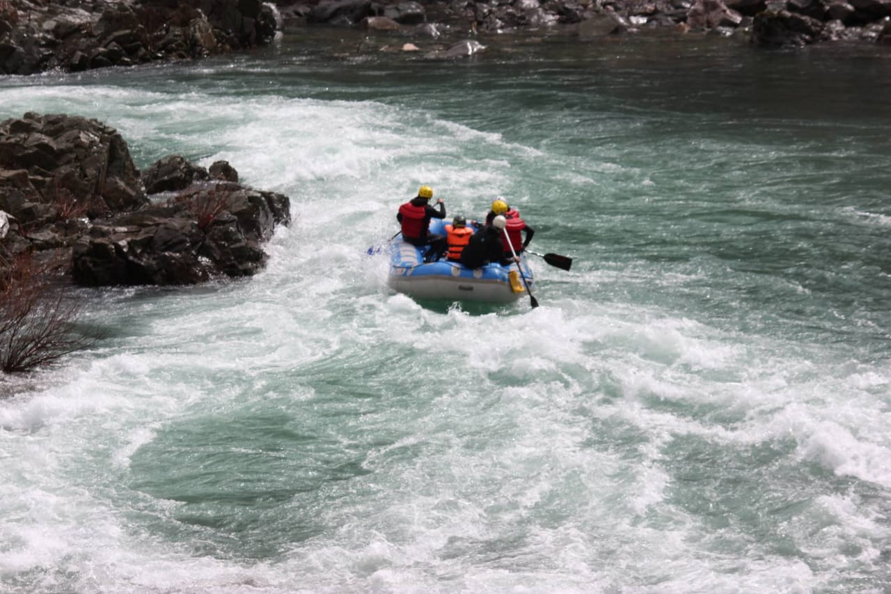 A group of people are rafting down a river.