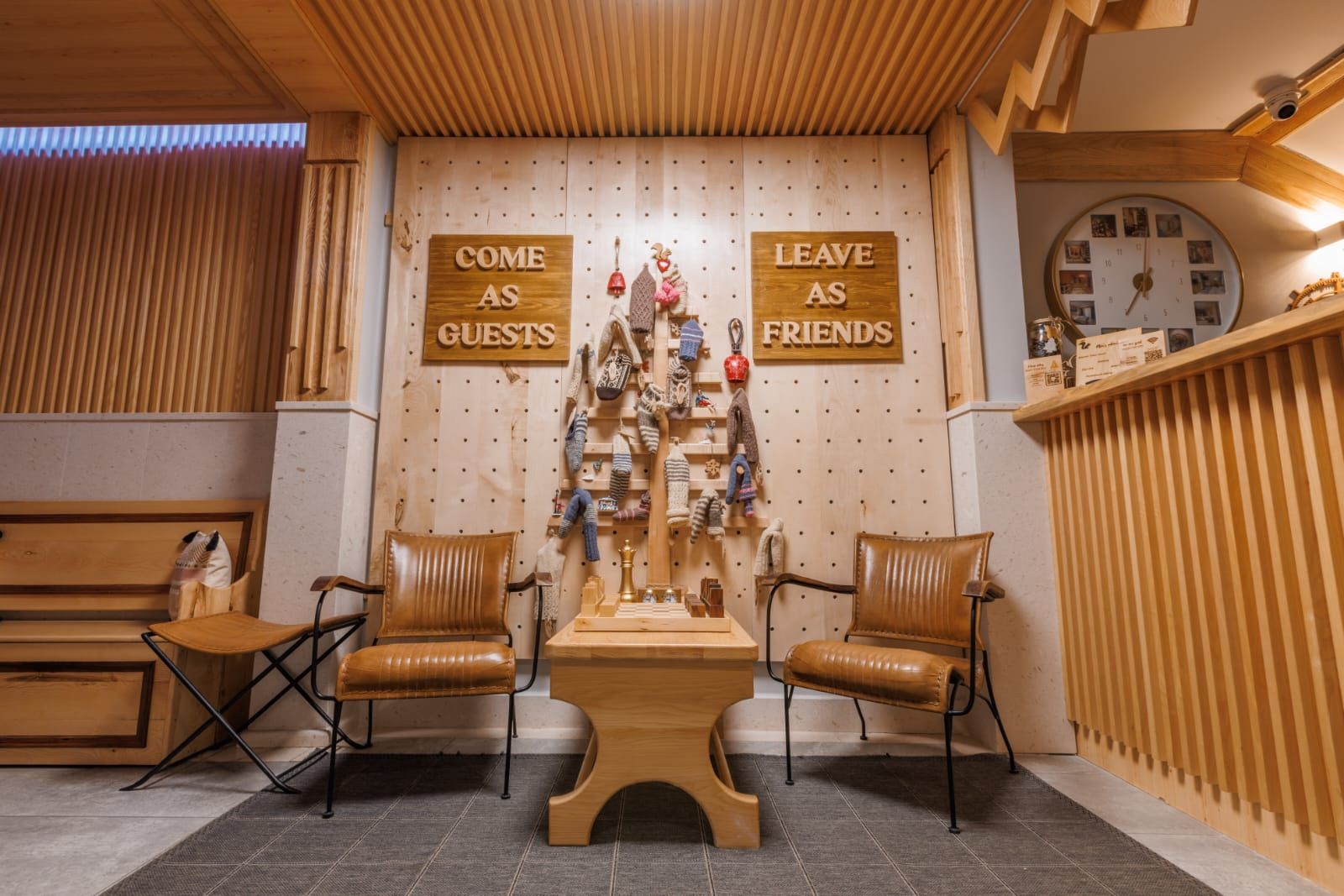 A hotel lobby with signs that say, 