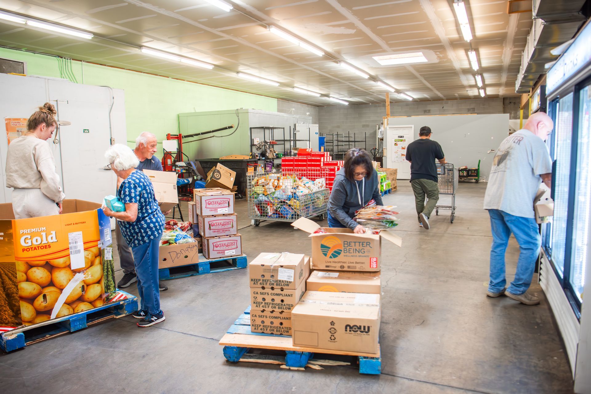 A group of people are working in a warehouse.