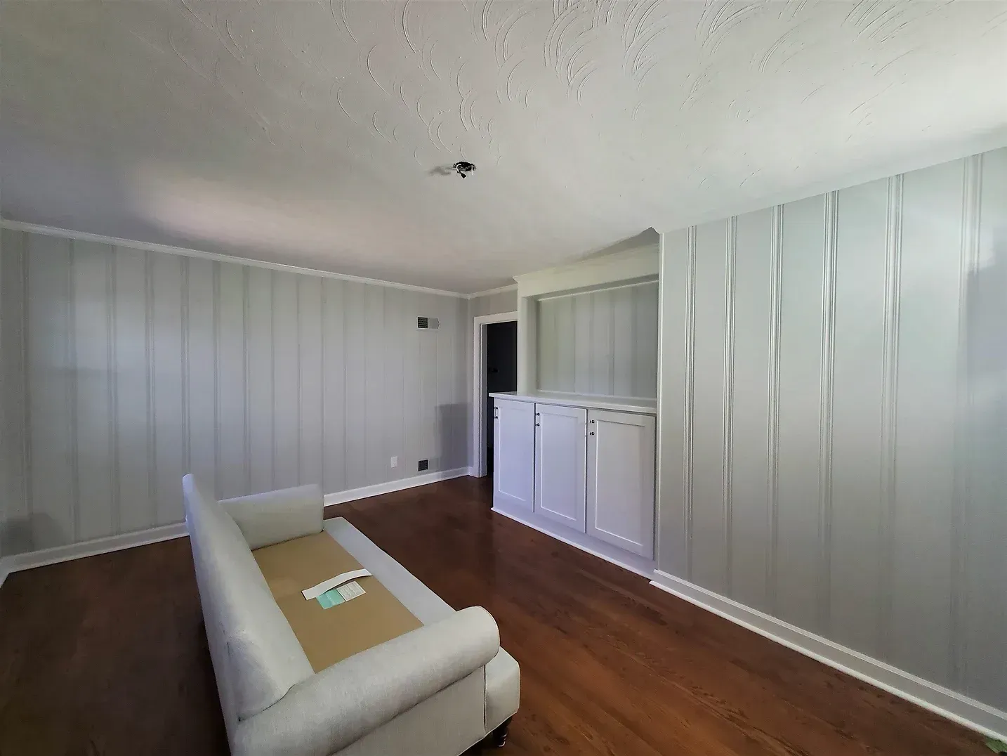 Gray Painted Wood Panelling with White Trim