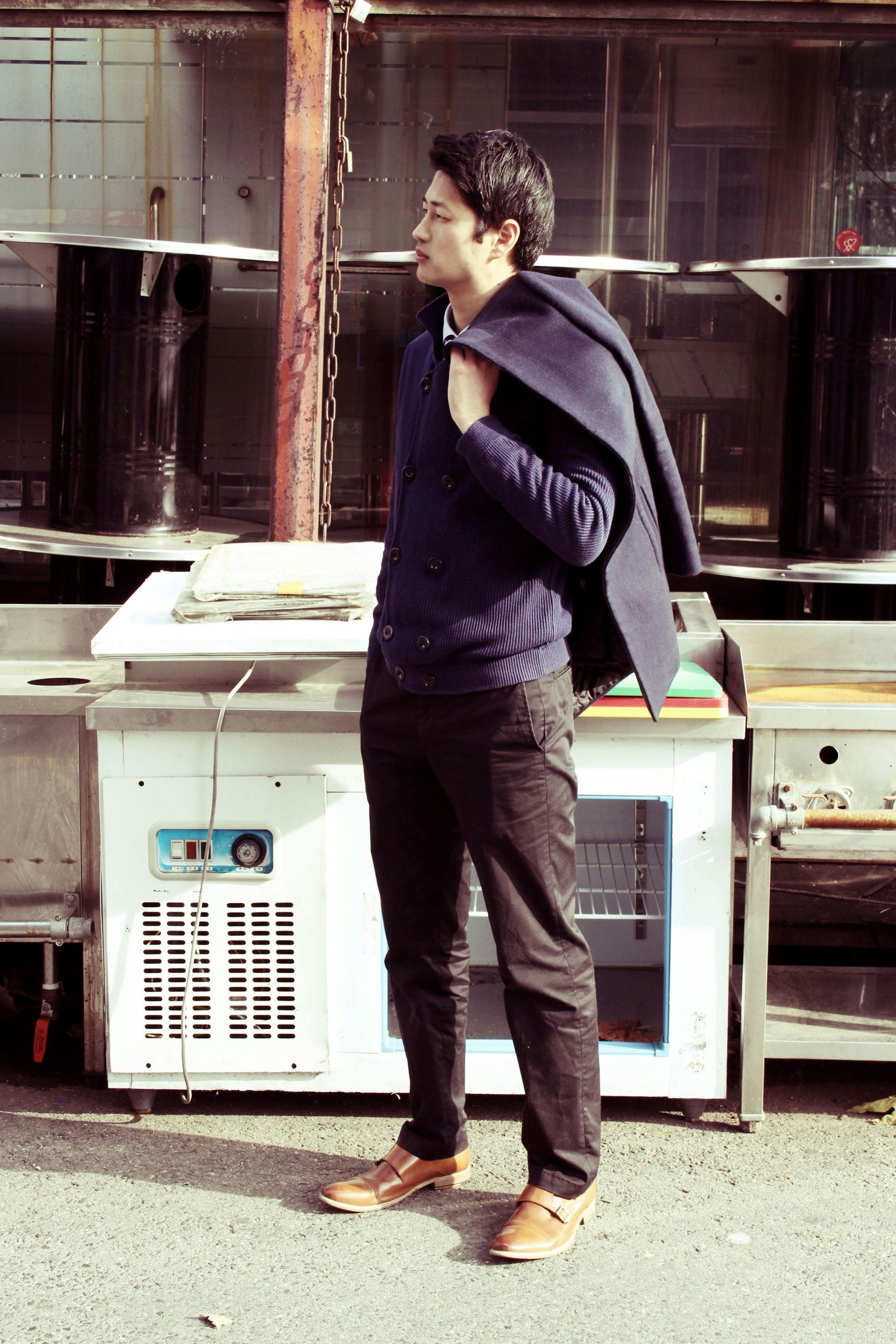 A broken appliance on the side of the road