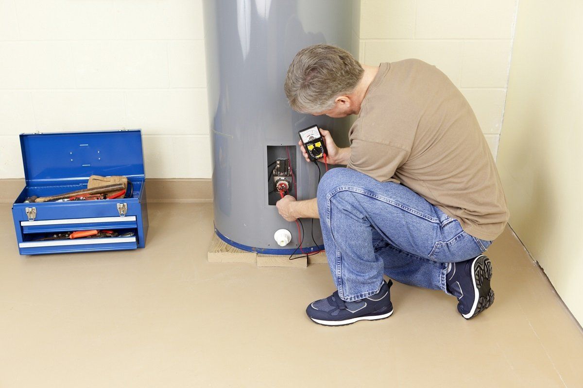 Plumber checking water heater | Gray, GA | Advanced Plumbing Co.