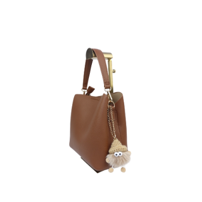 Bruine tas met sleutelhanger