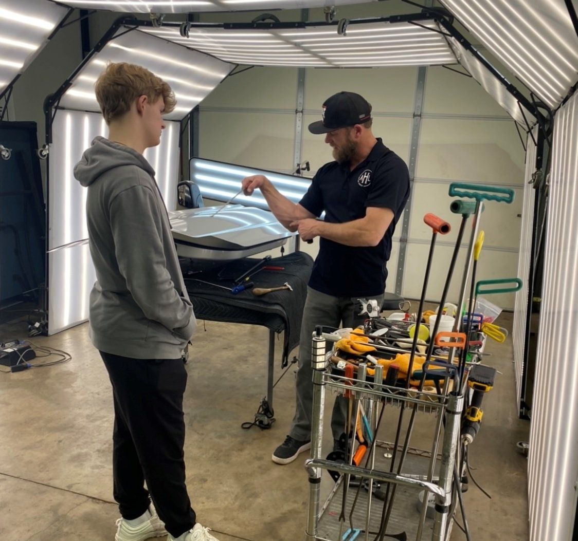 Mechanic Performing Dent Repair — Edmond, OK — Auto Hail Logistics