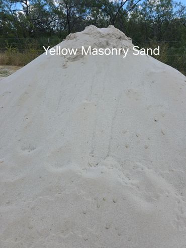 Pile of yellow masonry sand.